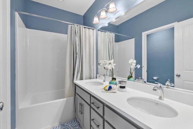 bathroom featuring vanity and shower / bathtub combination with curtain