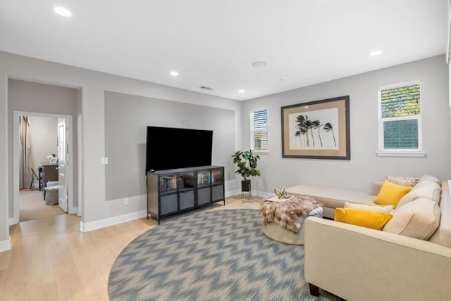 living room with light hardwood / wood-style flooring