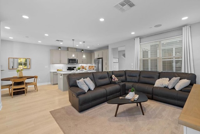 living room featuring light wood-type flooring