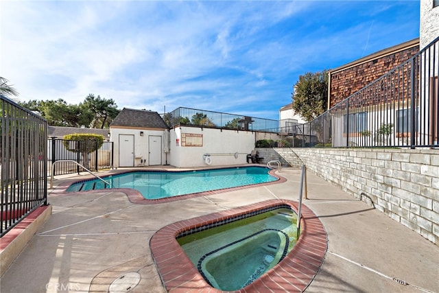 view of pool featuring a hot tub