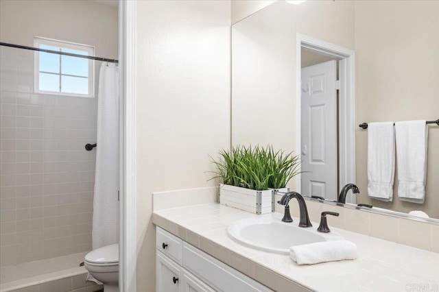 bathroom featuring vanity, toilet, and walk in shower