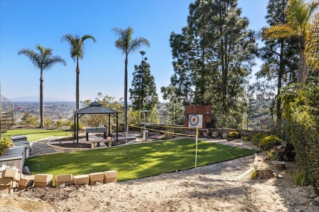 view of community with a gazebo, volleyball court, and a lawn