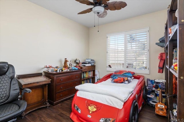 bedroom with dark hardwood / wood-style floors and ceiling fan