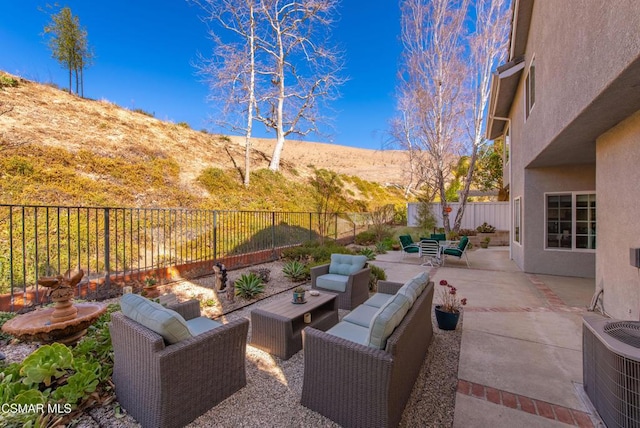 view of patio / terrace featuring an outdoor living space and cooling unit