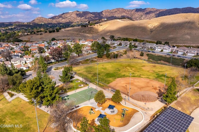 birds eye view of property with a mountain view