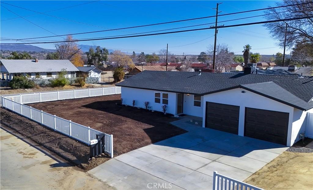 ranch-style house featuring a garage