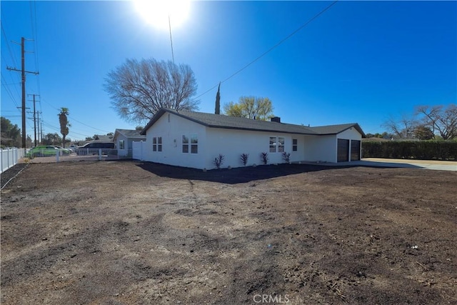 view of side of home featuring a garage