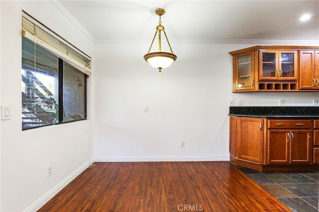 unfurnished dining area featuring crown molding