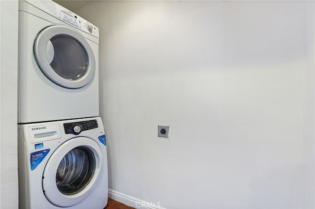 washroom with stacked washer and clothes dryer