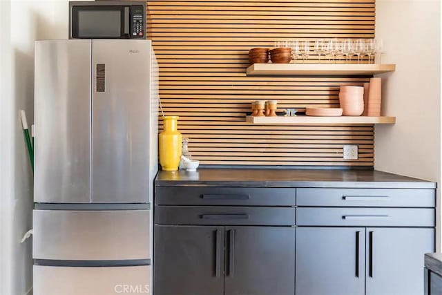 kitchen with appliances with stainless steel finishes and gray cabinetry