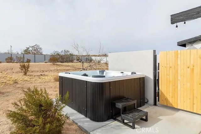 exterior space featuring a hot tub