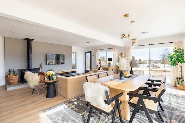 dining room featuring a chandelier and light wood-type flooring