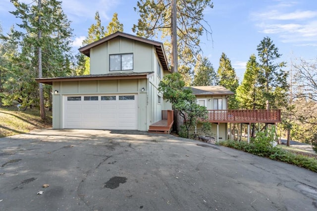 view of front of house featuring a wooden deck and a garage