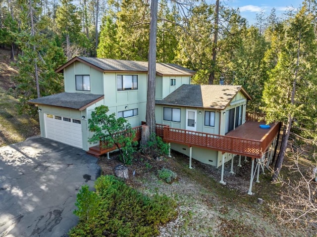 back of property with a wooden deck