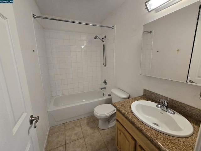 full bathroom with vanity, toilet, tiled shower / bath combo, and tile patterned flooring