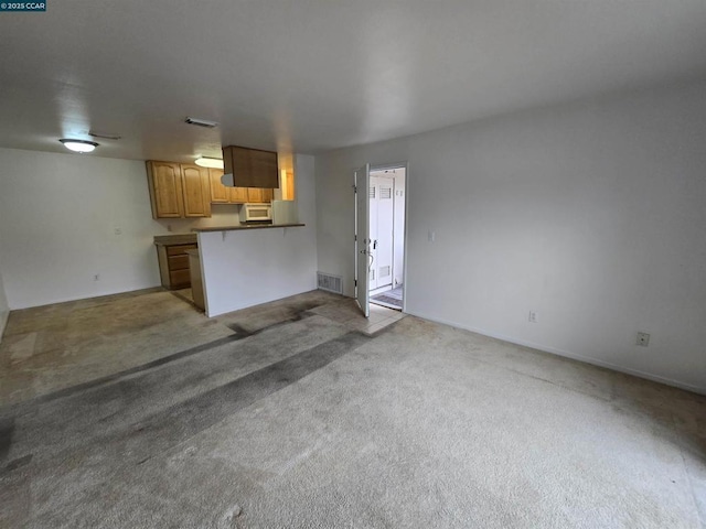 unfurnished living room with carpet floors