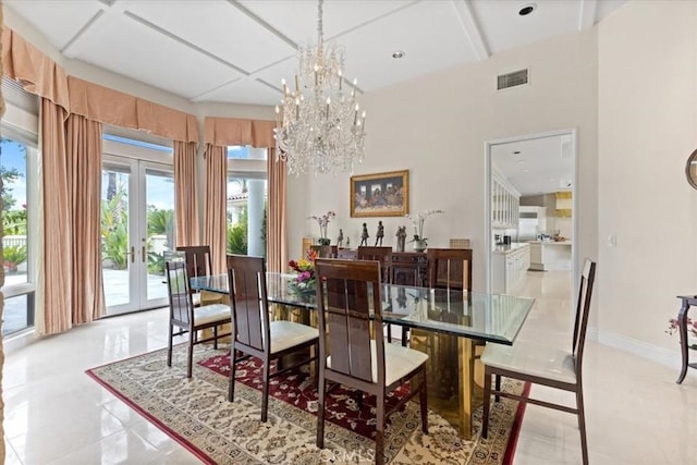 dining room featuring french doors, coffered ceiling, and a chandelier