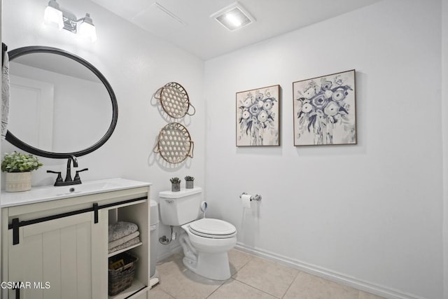 bathroom featuring vanity, toilet, and tile patterned flooring