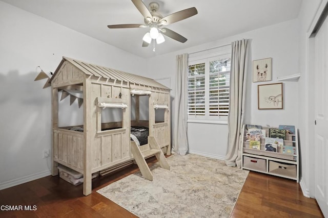 bedroom featuring dark wood-type flooring and ceiling fan