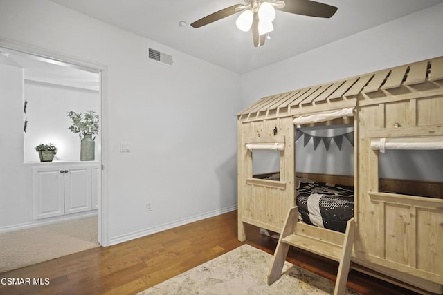 bedroom featuring hardwood / wood-style floors and ceiling fan