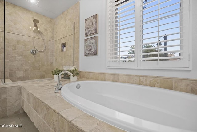 bathroom with shower with separate bathtub