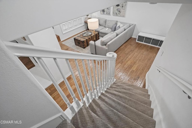 stairway featuring hardwood / wood-style floors