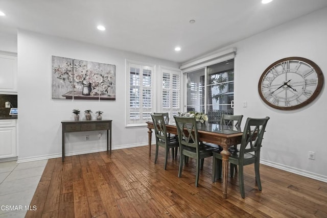 dining space featuring light hardwood / wood-style floors