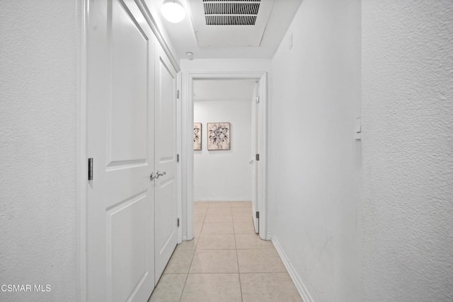 hallway with light tile patterned floors