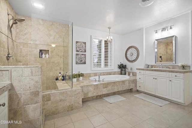 bathroom featuring vanity, a notable chandelier, tile patterned flooring, and shower with separate bathtub