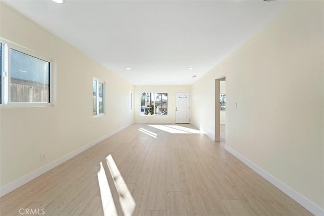 unfurnished living room with light wood-type flooring