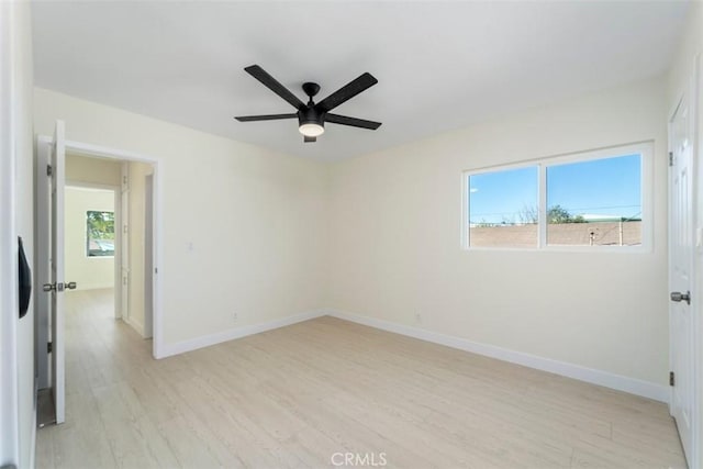 spare room with ceiling fan and light hardwood / wood-style flooring