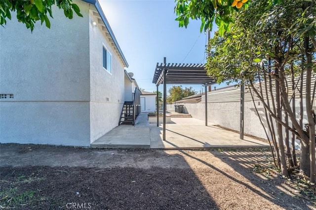 exterior space featuring a pergola and a patio