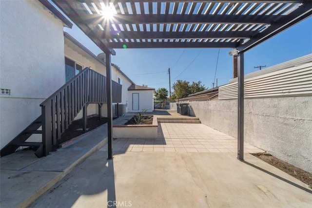 view of patio featuring a pergola