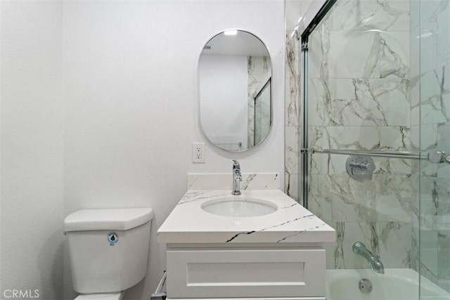 full bathroom with vanity, shower / bath combination with glass door, and toilet