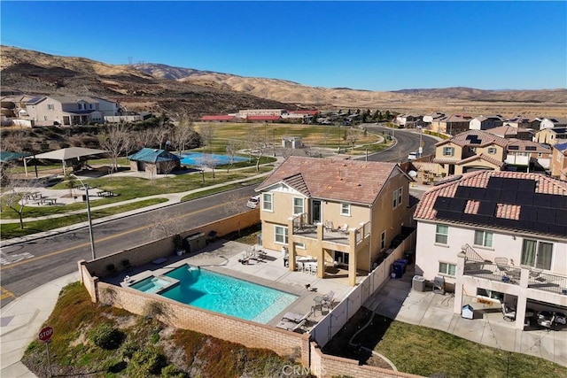 birds eye view of property featuring a mountain view