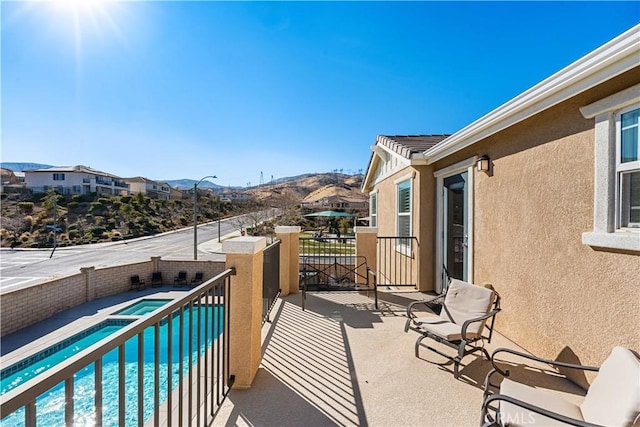 balcony featuring a mountain view