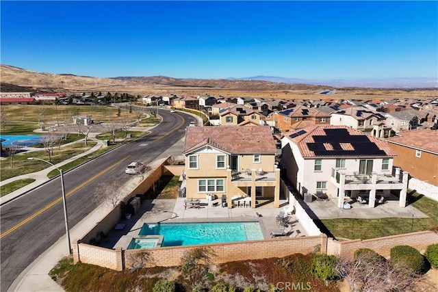 birds eye view of property with a mountain view