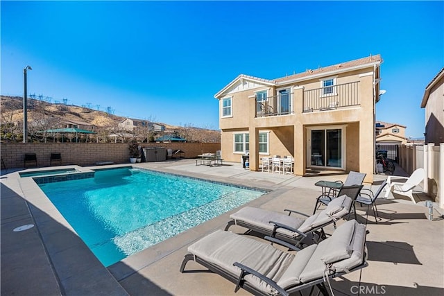 view of pool featuring an in ground hot tub and a patio