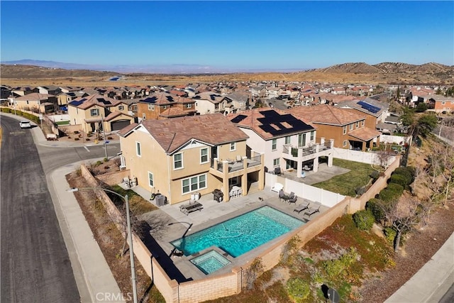 birds eye view of property featuring a mountain view