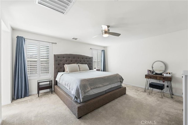 bedroom with light carpet and ceiling fan