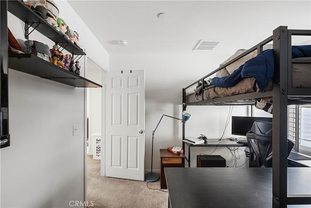 bedroom featuring light carpet