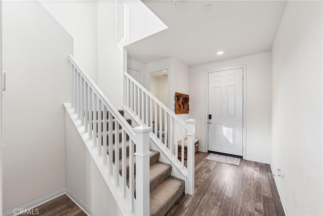 entrance foyer featuring dark wood-type flooring