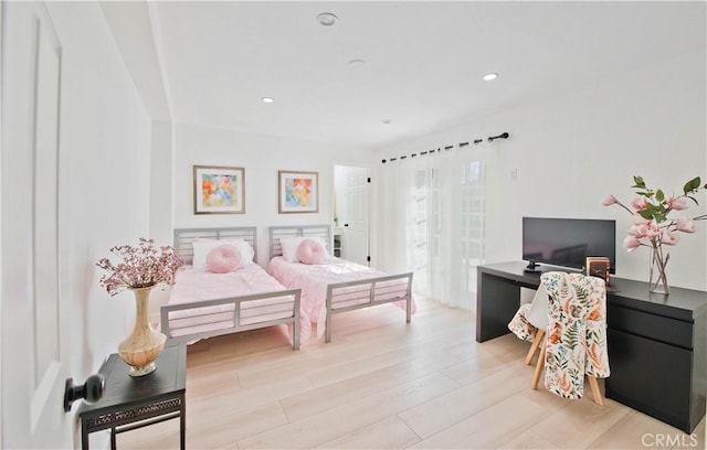 bedroom with light hardwood / wood-style floors