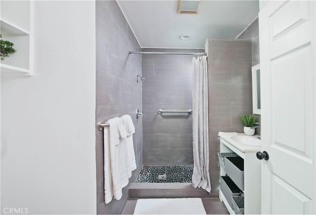 bathroom featuring vanity and curtained shower