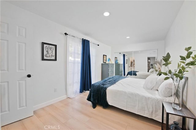 bedroom with light hardwood / wood-style flooring