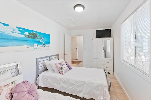 bedroom with light hardwood / wood-style flooring