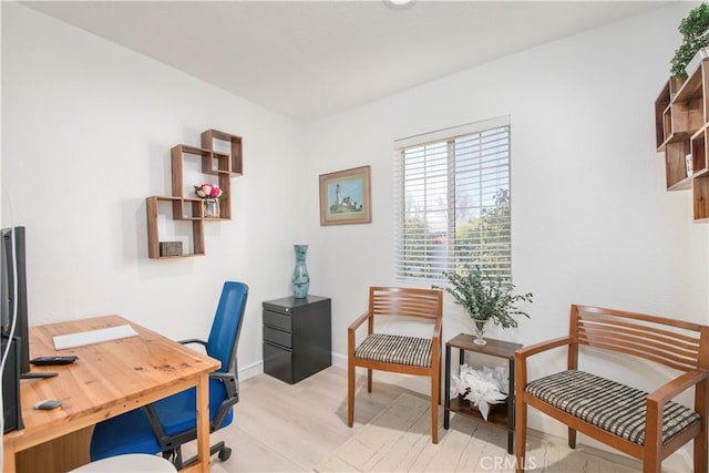 office space with light hardwood / wood-style floors