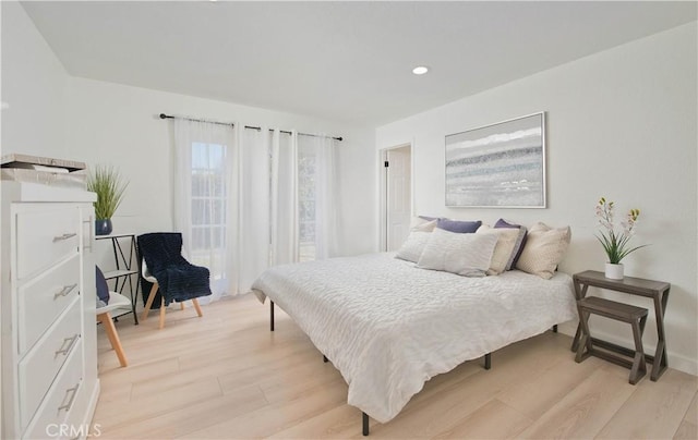 bedroom with light hardwood / wood-style flooring