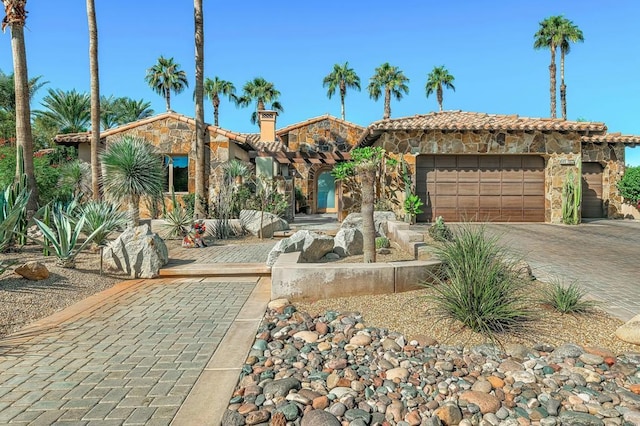 mediterranean / spanish-style house featuring a garage