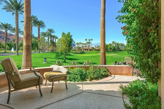 view of home's community with a yard and a patio